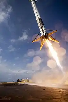 Falcon 9 Flight 17's first-stage attempting a controlled landing on the drone ship following the successful launch of CRS-6