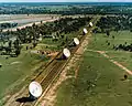 East-west track of Array, before construction of north spur. 6th dish in far distance.