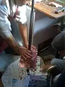 Stacking the lamb slices on the cağ