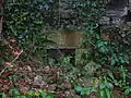 Detail of an opening in the gable end of the old mill.