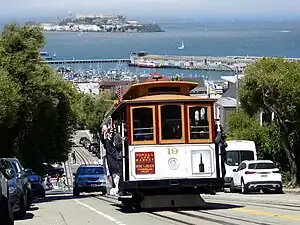 A cable car on a steep urban street