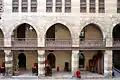 Stone arches along the courtyard