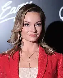 Photo of Caitlin O'Connor, a blonde woman, smiling for the camera