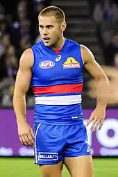 Male athlete in sleeveless guernsey