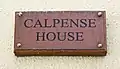 Plaque at the entrance to Calpense House.