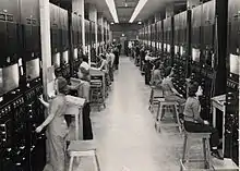 Photograph of calutron operators at Oak Ridge during the Manhattan Project