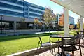 Green space and outdoor seating on campus.