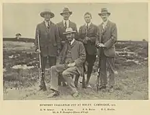 Team photograph of a rifle shooting team, in black and white.