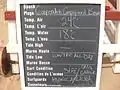 Board with daily conditions at campground entrance to beach