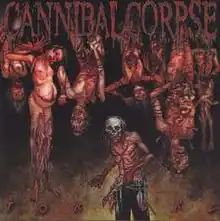 a grotesque figure stands in front of a lot of mutilated corpses.