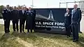 Lt. Gen. Nina Armagno, Rep. Bill Keating, Lt. Col. Timothy Sheehan, and other dignitaries including Walter Taylor and Greg Moore attend the installation's redesignation as a Space Force Station.