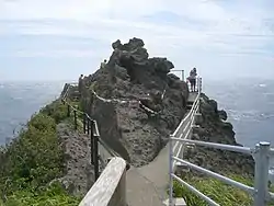 Viewpoint and shimenawa encircling rock at Cape Irōzaki