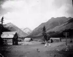 Two children and a dog in Capitol City (Galena City), Colorado, circa 1880-1900.