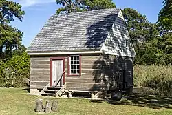 The style of planked log building called a plank house after the rectangular shape of the wall timbers.