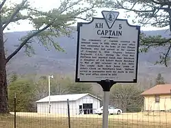 Historical marker in Captain, detailing the history of the town name