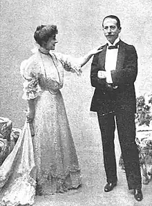white woman and man side by side in early 20th-century clothes