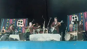 A composite image of the band onstage