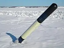 A light buoying cardinal mark (east) in pressure of ice in front of Helsinki, Finland in winter. Notice that topmark is not used on a buoy that is subjected to ripping by movements of ice.
