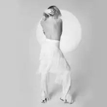 Black-and-white photograph of Carly Rae Jepsen from behind