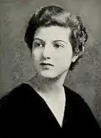 Woman with dark hair facing right