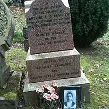 Marble gravestone with inscription "A token of esteem to the memory of Caroline E D Martyn, born at Lincoln 3rd May 1867, died at Dundee 23rd July 1896. A devoted worker in the cause of humanity. Erected by Socialist comrades and Dundee Textile Workers Union."
