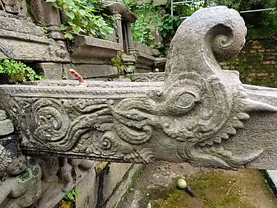 Carvings on one of stone water fountain behind Bajrayogini temple