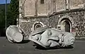 Sculptures of the heads of Saints Cassius and Florentius in front of the church