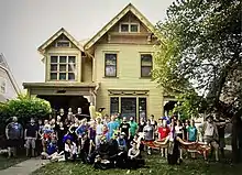 Cast of Spiderman the Musical, the Musical in front of the Albert Watkins House