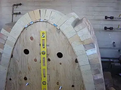 Catenary arch kiln under construction over temporary form