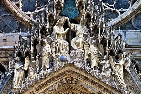 Sculpture over the central portal:the crowning of the Virgin Mary