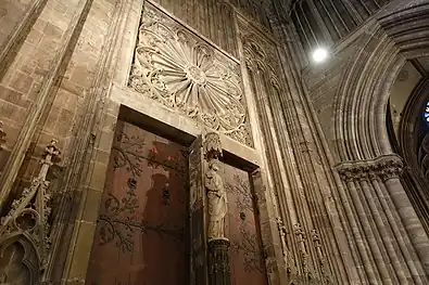 Inside of west front doors, with blind rose window and column-statue of St. Peter