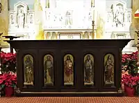Figures of Jesus and the saints on the altar were once a part of the pulpit