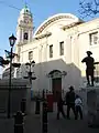 The exterior of the Cathedral of St. Mary the Crowned. The statue of the soldier outside the cathedral is a gift from the Corps of the Royal Engineers to commemorate the formation in Gibraltar of the Company of Soldier Artificers in 1772, which later became the Royal Engineers in 1856.