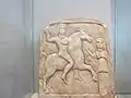 Thracian rider of "Scythian" type, with raised hand, riding towards female figure, Madara Museum, Bulgaria