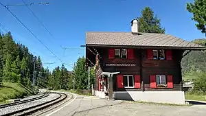 Two-story chalet-style building with gabled roof