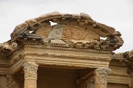 Roman mascaron with rinceaux in a segmental pediment of the Library of Celsus, Ephesus, Turkey, unknown architect, c.110 BC