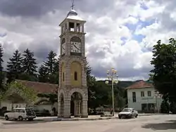 The central square in Chuprene with the clock tower, the church and the school