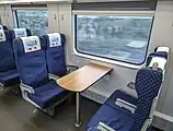 The table seats located at the center of second class cars