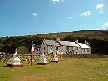 The Centre for World Peace and Health, with Tibetan flags and stupas