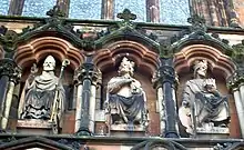 St Chad (left), alongside Mercian kings Peada and Wulfhere, as portrayed in 19th century sculpture above the western entrance to Lichfield Cathedral.