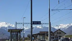 Canopy-covered platforms with mountains in the background