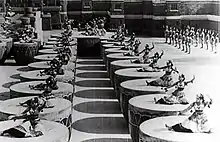 Women dancing on giant drums