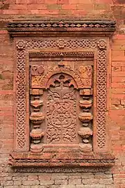 Terracotta arabesque on the wall of Khania Dighi Mosque, Gauda, 15th-century