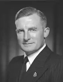 Black and white portrait of man wearing suit