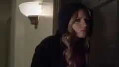 Actress Vanessa Ray as CeCe Drake eavesdropping on a conversation, using a black hoodie, blonde hair.
