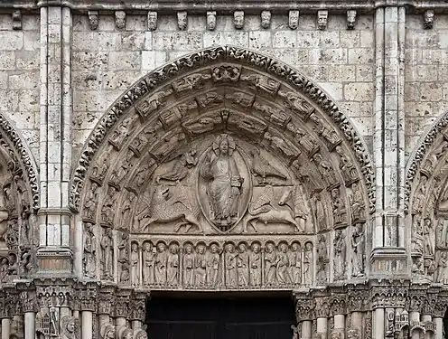 Central tympanum of the Royal Portal. Christ seated on a throne, surrounded by the symbols of the Evangelists; a winged man for St. Matthew, a lion for St. Mark; a bull for St. Luke; and an eagle for St. John.