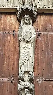 Central doorway of the south portal, with column statue of Christ.  His feet rest on a lion and a dragon.