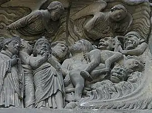 Detail on the south portal depicting angels looking down upon hell