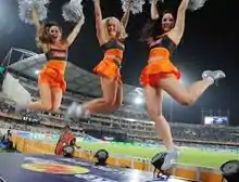 Cheerleaders cheering for SRH wearing team colours