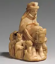 A 13th century Queen astride a horse with attendants, of Scandinavian origin.  The Queen replaced the Persian Vizier in European chess.